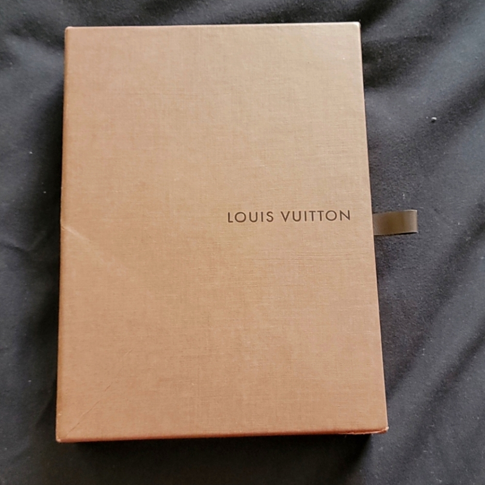 Louis Vuitton box, cloth bag, and phone case